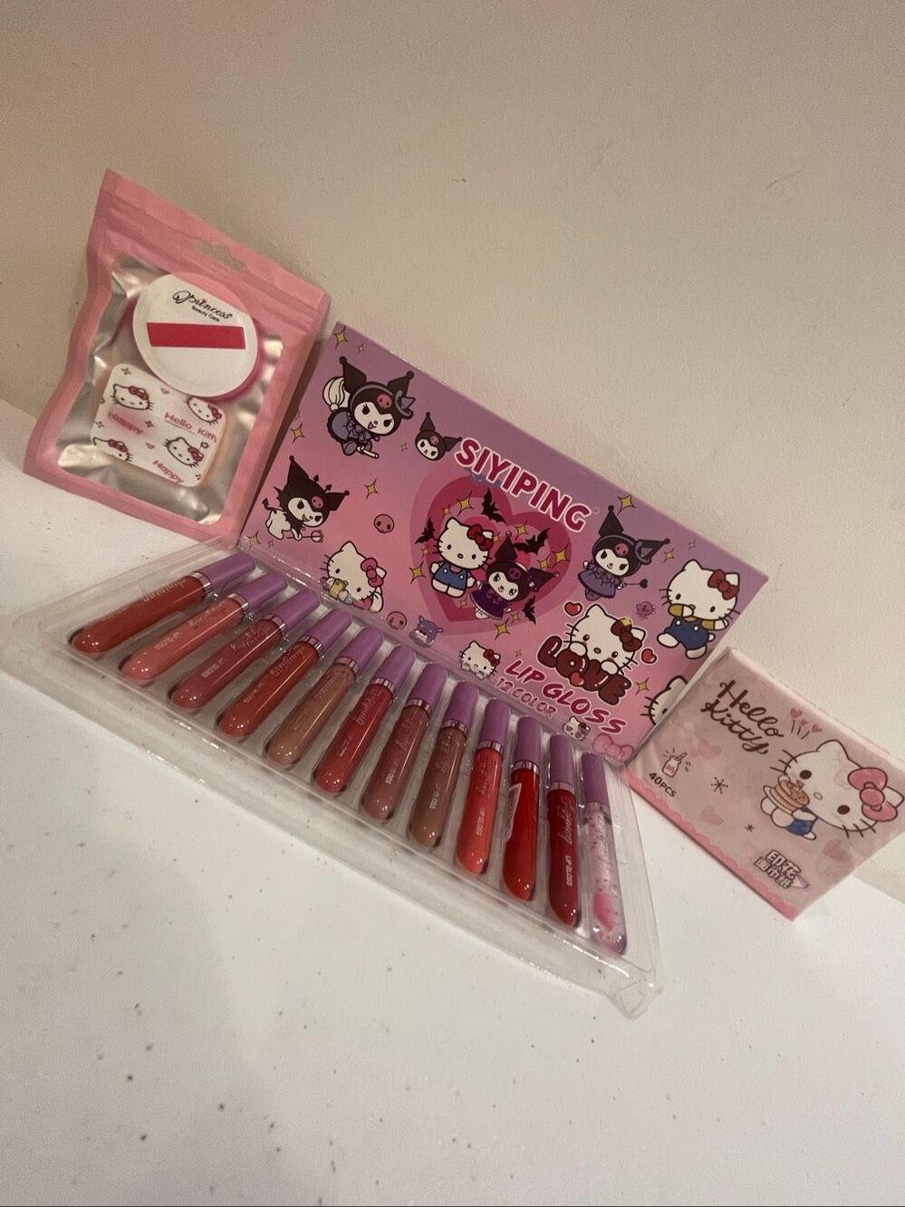 Hello Kitty Siyiping 12 color lip gloss, napkins and makeup sponges